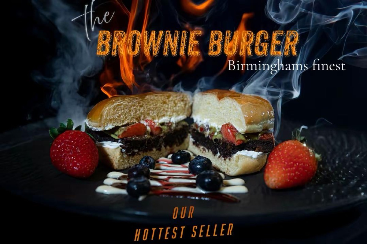 Poster design for Qaiso's brownie burger, lit against a dark background with smoke
